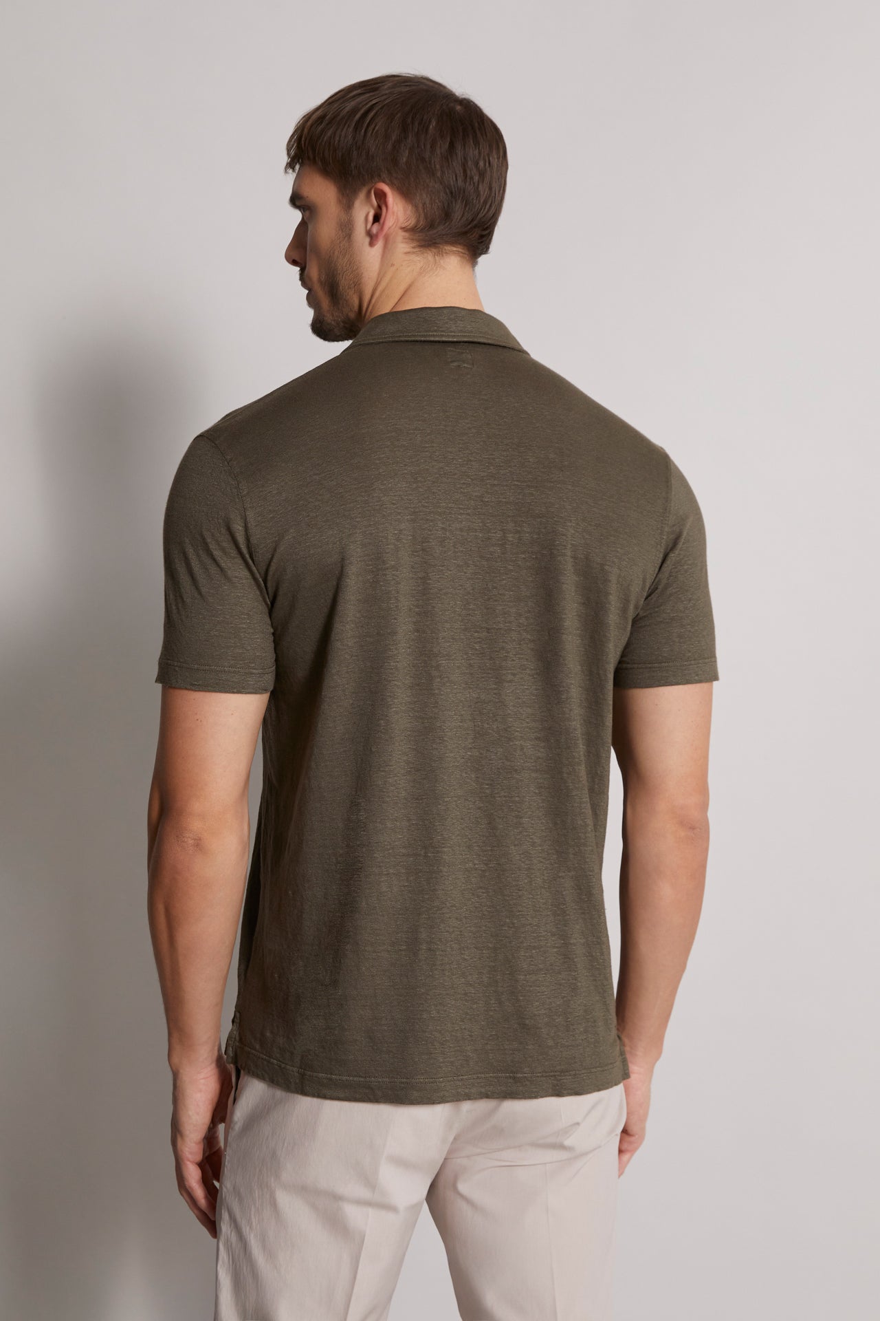 linen polo t-shirt in olive green - back view