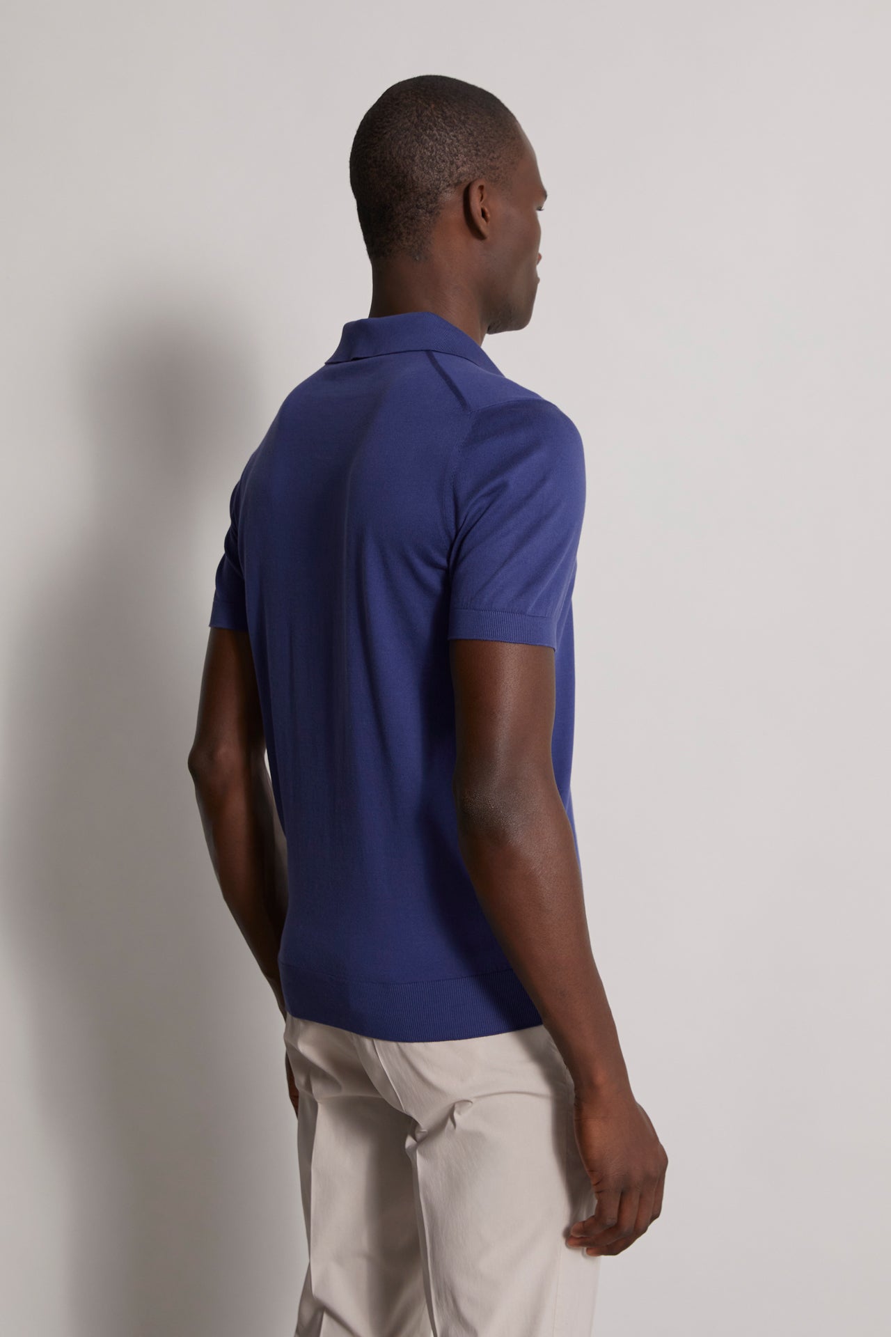 Buttonless organic cotton knitted polo t-shirt blue - back view