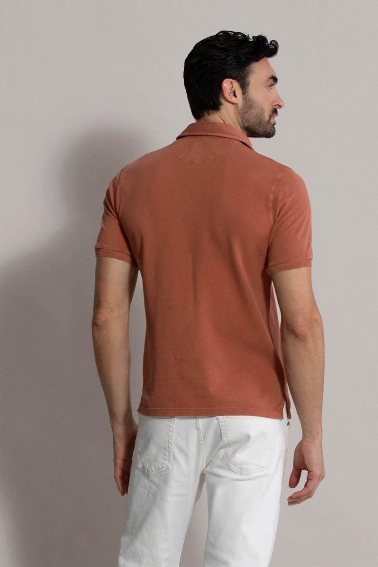 North: short sleeves cotton polo in orange - back view