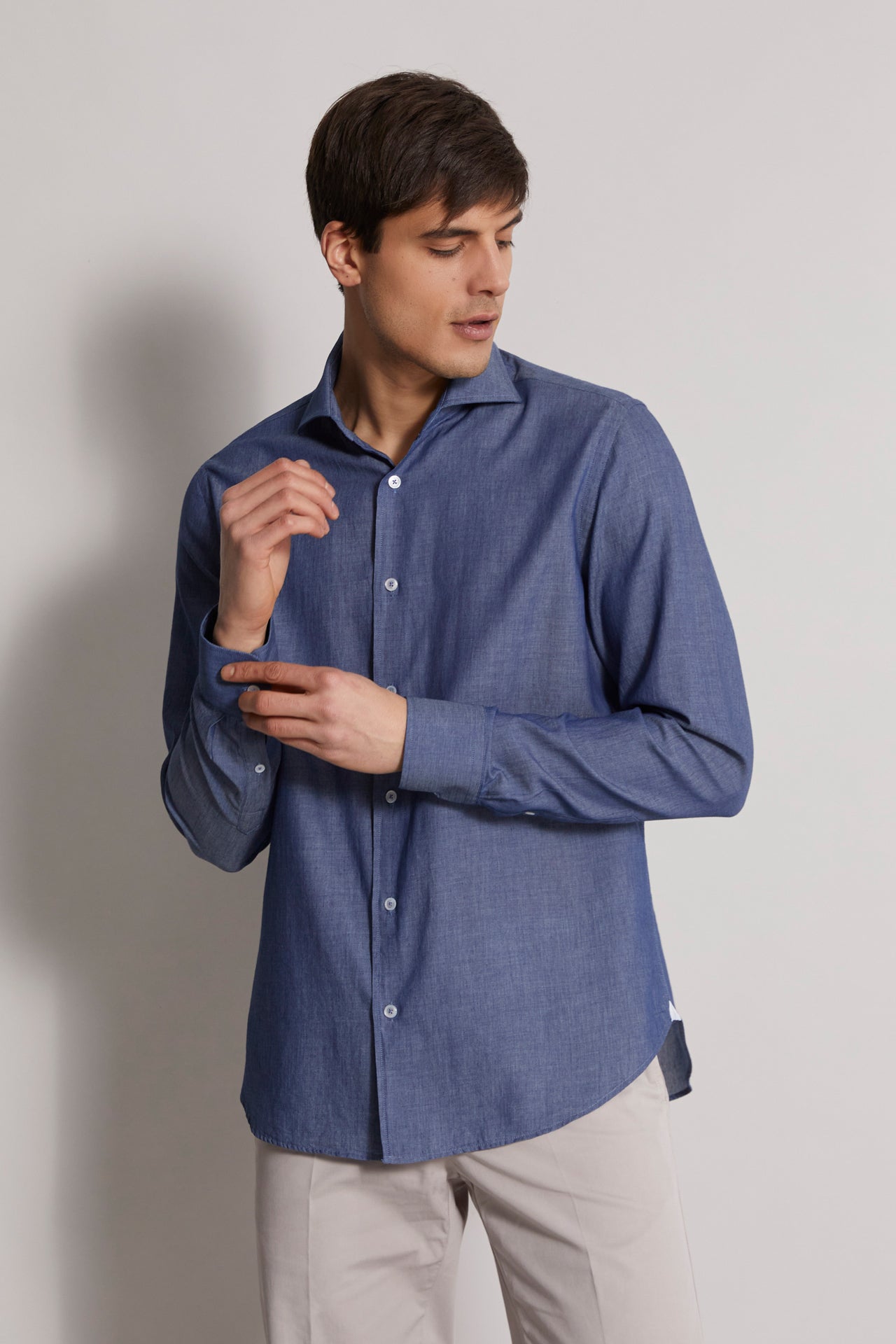 men's designer denim shirt with long sleeves in navy blue - front view