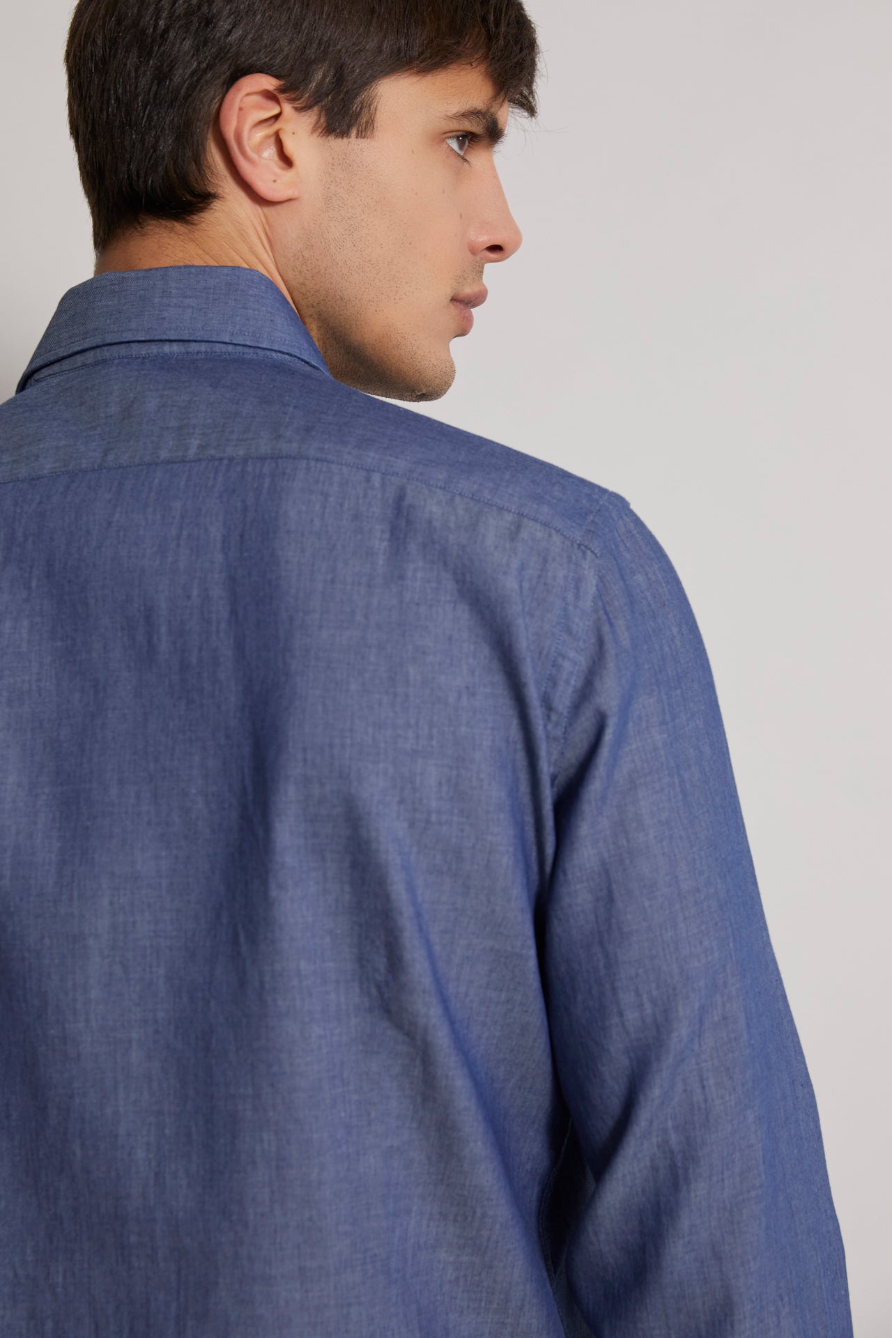men's designer denim shirt with long sleeves in navy blue - back view