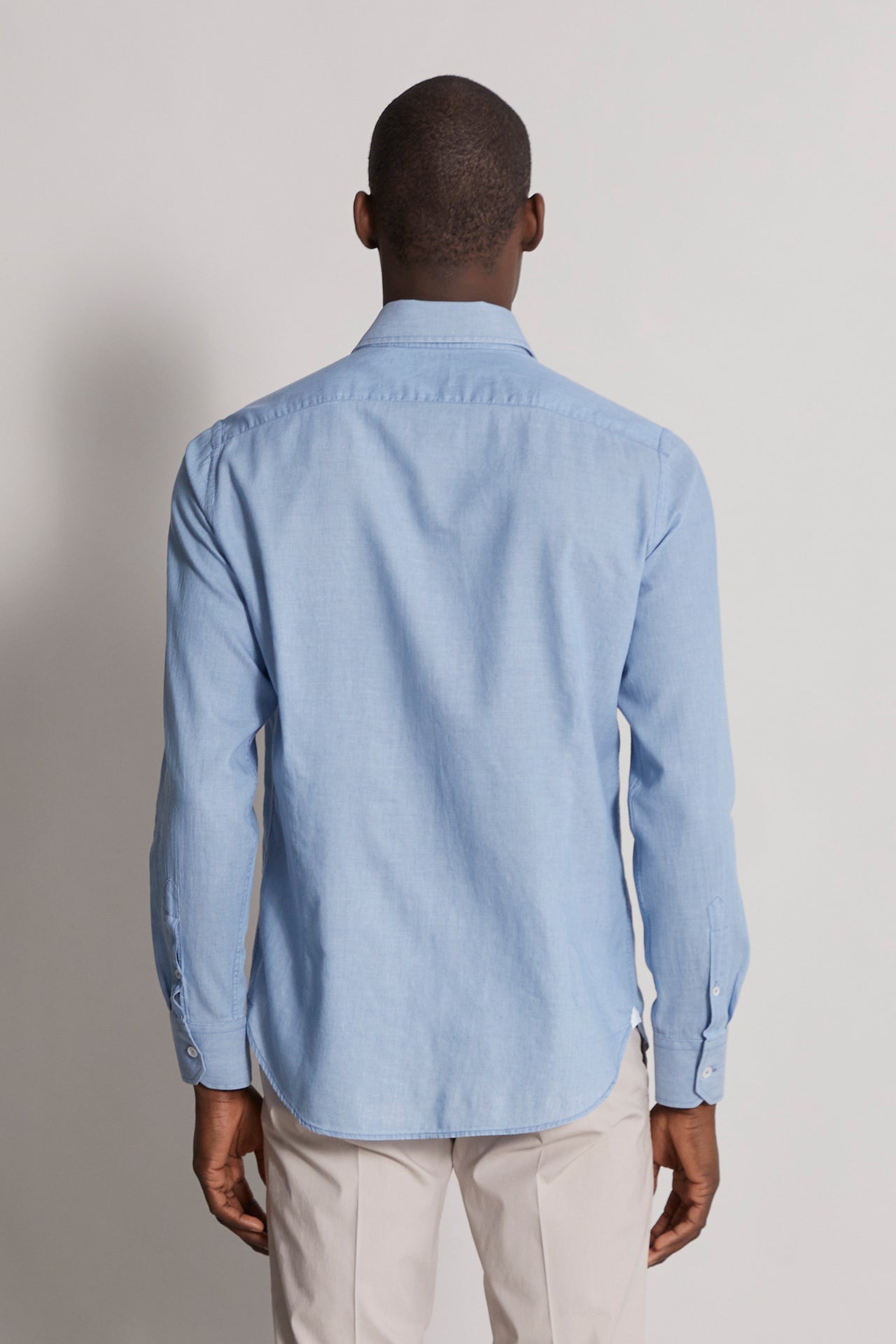 men's designer denim shirt with long sleeves in steel blue - back view