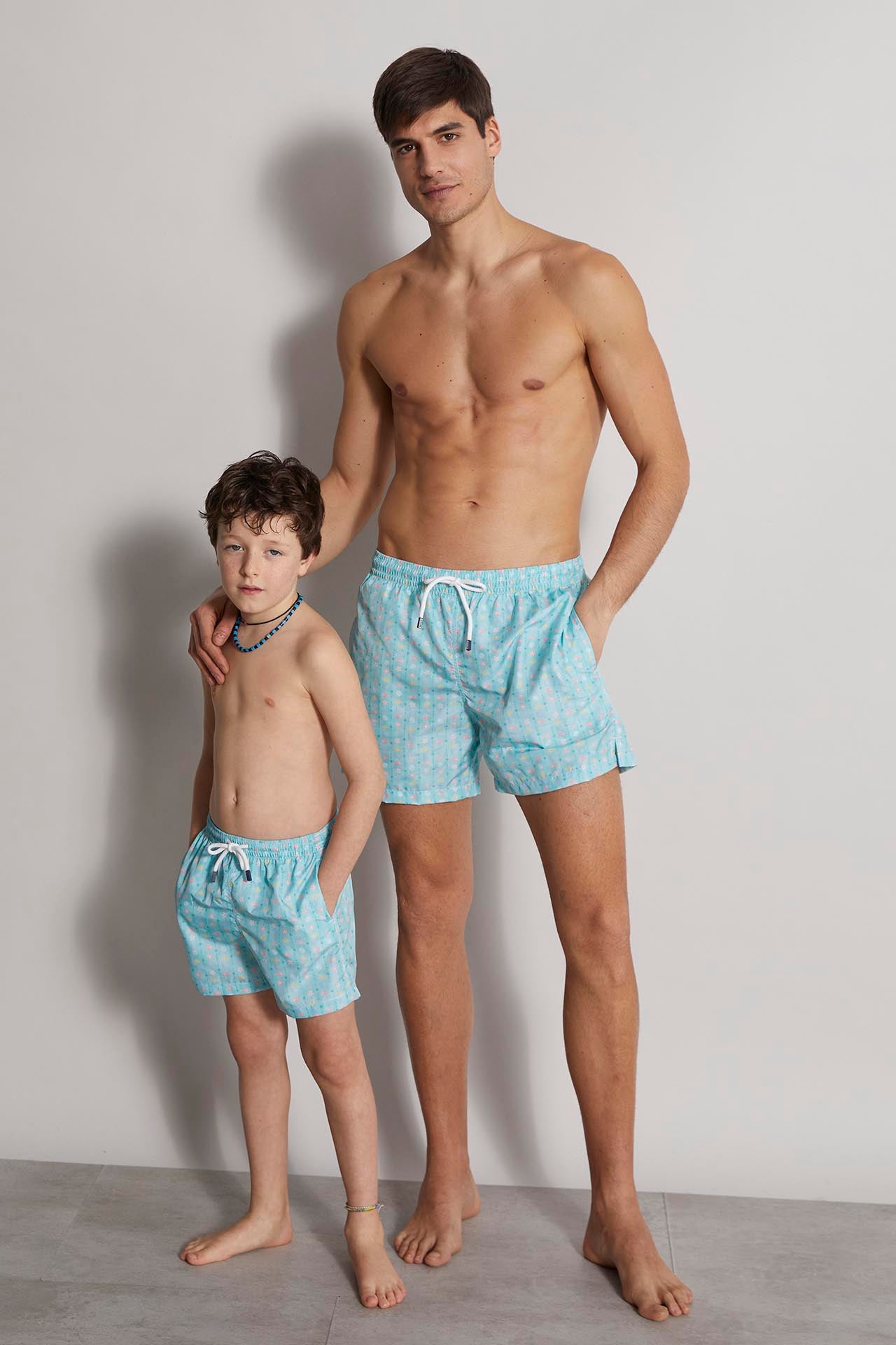 sustainable designer swim trunks madeira - blu green shells pattern