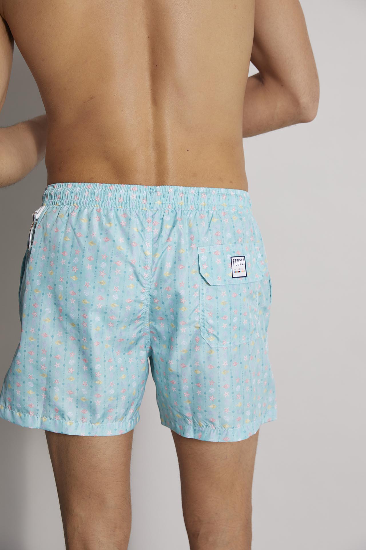 sustainable designer swim trunks madeira - blu green shells pattern