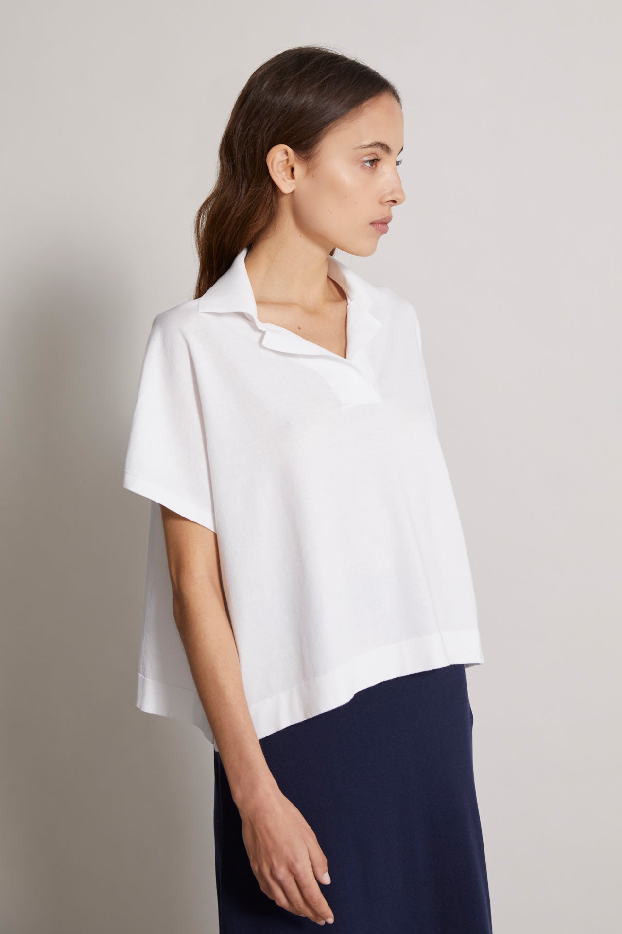 women's short sleeves buttonless knitted cotton polo in white - back view